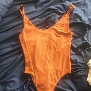 Scoop neck burnt orange body suit-